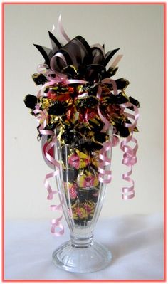 a vase filled with lots of different colored streamers