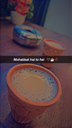 two cups sitting on top of a table next to each other with the caption mohabbat hai to hai