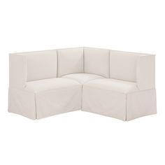 a white couch with four cushions on it