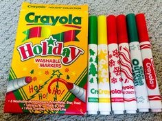 crayola holiday washable markers are lined up next to each other on the floor