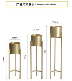 an image of a gold metal planter and stand with measurements for each one in chinese