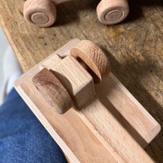 a wooden toy on top of a wooden board