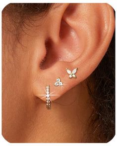 PRICES MAY VARY. [Lightweight Gold Earrings Set]: 3 pairs Dainty gold hoop earrings for women, include one pair of small hoop earrings, one pair of tiny tri - diamond gold stud earrings, and one pair of butterfly cubic zirconia earrings studs, a perfect blend of chic gold hoops and delicate studs. Enjoy all-day comfort, forgetting they're even on your ears. [Materials]: Hypoallergenic earrings for women, our gold huggie hoop earrings and gold studs are crafted with nickel-free, lead-free, and en 3 Stack Earrings, Cartlidge Earring Ideas, Piercing Stacks, Cartlidge Earrings, Dr Accessories, 3 Ear Piercings, Gold Earrings Set, Earring Inspo, Earrings Cartilage