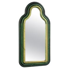 a mirror that is sitting on top of a wall with an arch shaped mirror in the middle