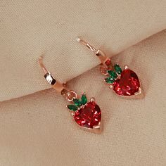 Strawberry Earrings, Rose Gold Plated, Red Strawberry Earrings, 925K Silver Earrings, Fruit Earrings, Summer Earrings, With Zircon Stone The most popular jewelries of the summer months are the ones with fruit figures. Their bright and lively appearance fascinates people. By purchasing these beautiful products, you can make yourself and your loved ones taste this happiness. :) *Silver strawberry fruit earrings with zircon stones are made of 925 sterling silver. *Rose gold plated on this earring. Red Single Earring Fine Jewelry, Red Fine Jewelry Hoop Earrings As Gift, Red Drop Earrings Fine Jewelry, Rose Gold Ear Wire Jewelry For Valentine's Day, Sterling Silver Star Earrings, Strawberry Earrings, Phoenix Necklace, Phoenix Pendant, Enamel Stud Earrings