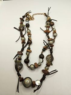 Vintage Chico's necklace in very good Vintage condition! Vintage Brown Adjustable Necklace, Adjustable Brown Vintage Necklace, Earthy Brown Necklace For Jewelry Making, Handmade Brown Double Strand Jewelry, Brown Double Strand Beaded Necklace For Gift, Brown Multi-strand Beaded Necklace For Gift, Brown Multi-strand Costume Jewelry, Adjustable Brown Beaded Choker Necklace, Vintage Brown Long Necklace As A Gift