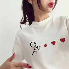 a woman with her hand on her hip wearing a t - shirt that says i love you