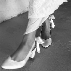 black and white photograph of bride's shoes