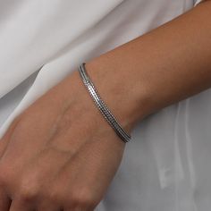 Madison didn't have to try to look better than everyone else. The bracelet's shine comes to it naturally. The design will give every outfit your outstanding personality, so everyone will know who owns the room. Everyday Silver Braided Bangle Bracelet, Silver Braided Bangle Bracelet For Everyday, Silver Braided Bracelets For Everyday, Modern Silver Stackable Chain Bracelet, Silver Timeless Chain Bracelet For Everyday, Classic Flexible Sterling Silver Jewelry, Everyday Silver Sterling Braided Bracelets, Everyday Silver Sterling Silver Braided Bracelet, Flexible Classic Sterling Silver Jewelry