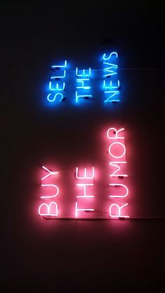 two neon signs that are on the wall