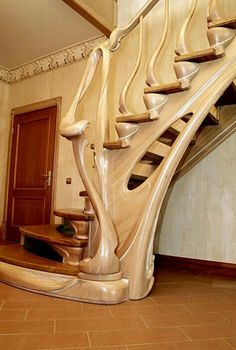 a spiral staircase in a house with tile flooring