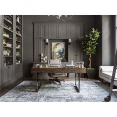 a home office with gray walls and furniture