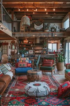 a living room filled with lots of furniture and rugs on top of a wooden floor