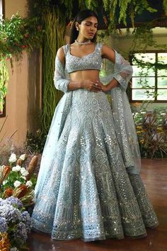 Aqua lehenga with mirror-work, Swarovski embellishments and bead work in self color. Comes with embroidered blouse and sheer dupatta.
Components:3
Embroidered
Neckline:V Neck
Sleeve Length:Sleeveless
Fabric:Net
Color:Blue

Tassel tie-up back - Aza Fashions Aqua Blue Lehenga, Light Blue Lehenga, Blue Bridal Lehenga, Engagement Lehenga, Mirror Work Lehenga, Sangeet Outfit, Net Embroidery, Mehendi Outfits, Blue Lehenga