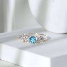 Product Details Indulge in the ultimate sparkle and beauty with our Criss Cross Engagement Ring, adorned with exquisite Round Shape Aquamarine and Diamond stones. The 5 MM Aquamarine Solitaire Ring is the perfect accessory to add a touch of elegance and sophistication to any womans wardrobe. With its stunning design and expert craftsmanship, this ring is sure to catch the eye and be a cherished addition to any jewelry collection. Dont miss out on the opportunity to be dazzled by this radiant and Cross Engagement Ring, Criss Cross Engagement Ring, Aquamarine Solitaire Ring, Infinity Engagement Ring, Fine Ring, 18k Yellow Gold Ring, Signature Jewelry, Aquamarine Rings, Timeless Jewelry