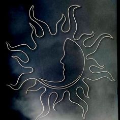 a drawing of the face of a sun with clouds in the background