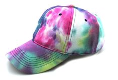 a tie dye baseball cap is shown on a white background with the colors of pink, blue, and green