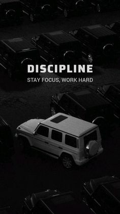 a black and white photo of cars parked in a parking lot with the words discipline on it