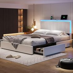 a bedroom with a bed, night stand and storage drawers on the floor in front of it