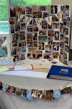 a table topped with pictures and cards on it