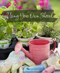 pots and gardening tools sitting on top of a table next to plants with the words, using your own shovel