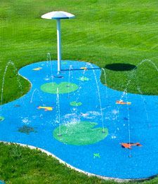 a water play area in the middle of a field