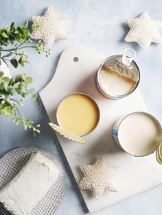 two mugs of tea on a cutting board with star decorations