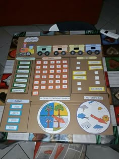 a cardboard board game with cars and trucks on it's sides, sitting on the floor