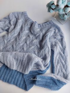 "The Light Blue Denim Ice Silver Double-Sided Mohair Sweater. Hand- knitted 100%. Let's favor elegance with a fluid and comfortable mohair sweater. This light mohair double-sided sweater by Knitalina is perfect for various outfit combinations and styles. Knitted cables give it style and versatility. The light material give it a nice, comfortable, airy feeling. It has length sleeves and a round neck and it's simple but playful at the same time. Size S-M: Width: approx. 48cm/19' Length: 52cm/21' S Blue Chunky Knit Sweater For Layering, Blue Crew Neck Knitting Pattern For Fall, Blue Cable Knit Sweater For Layering, Casual Blue Knitted Sweater, Casual Blue Knitting Pattern, Blue Hand Knitted Sweater, Blue Long Sleeve Knitting Pattern, Blue Chunky Knit Casual Knitting Pattern, Blue Hand-knitted Sweater