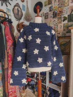 a blue sweater with white stars on it