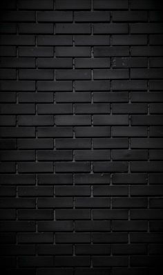 a black brick wall that is very dark