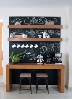 the coffee bar is decorated with chalk and wooden shelves