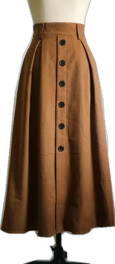 Fall A-line Skirt With Buttons, Brown Knee-length Skirt With Button Closure, Brown Maxi Skirt With Pockets For Fall, Fall Maxi Skirt With Pockets, Brown Solid Color Skirt For Fall, Brown Buttoned Skirt For Winter, Brown Wide Leg Winter Skirt, Solid Color Maxi Skirt For Fall Workwear, Beige Maxi Skirt For Fall