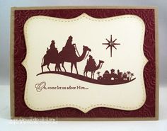 a christmas card with three wise men riding camels