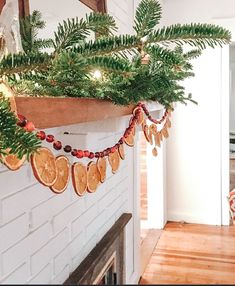 a christmas garland is hanging on the fireplace mantel