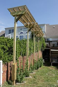 a wooden trellis in front of a house