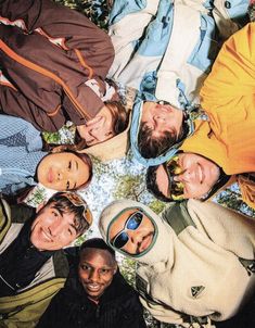 a group of people are standing in a circle