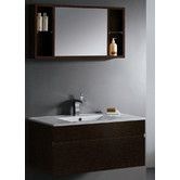 a bathroom vanity with a mirror above it and a sink under the cabinet, in front of a gray wall