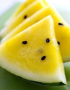 slices of watermelon with black dots on them are arranged in the shape of triangles