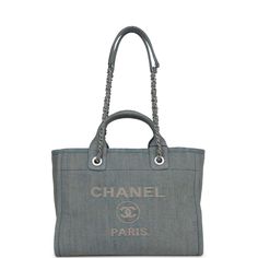 This Small Deauville Shopping bag is in Distressed Blue Denim with aged silver hardware, featuring a large CC signature and Chanel logo on the front, removable pouch, two rolled top handles, and two interwoven light gold chain link and pink leather shoulder straps.The interior is lined in blue fabric and has two open pockets on the front wall and a zipper pocket with a Chanel pull on the rear wall. Collection: 23SOrigin: ItalyCondition: New and never wornAccompanied by: Chanel box, Chanel dustba Chanel Box, Front Wall, Chanel Logo, Sierra Leone, Shopping Tote, Pink Leather, Handbag Backpack, Blue Fabric, Silver Hardware