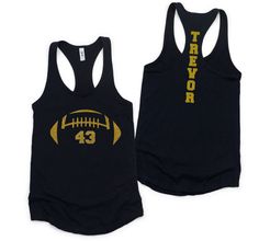 Personalized Glitter Football Mom Tank Top with Player's Number on Front and Name on Back.  Racer Back Tank Top in Your choice of Color and Glitter Design Colors.  This Next Level Brand Tank Top is sure to be a Fall Football Season favorite.    Please review size chart prior to placing your order.  This is women's fit cut tank top so if you prefer a looser fit, please size up a size.  TO ORDER: Choose Tank Color Choose Size Choose Heart, Number and Name Glitter Color from chart shown in last lis Custom Print Sports Tops For Football Season, Football Shirts With Numbers, Football Mom Shirts With 3 Players, Football Mom Tank Tops, Customizable T-shirt For Football Season, Football Mom Shirts Ideas, Glitter Football Shirts, Football Tank Tops, Cut Tank Top