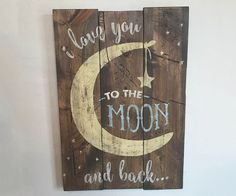 a wooden sign that says i love you to the moon and back