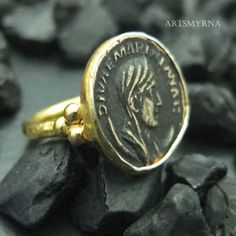 ARTSMYRNA METAL: 925k Silver GEM: Bronze Replica Coin COATING: 24k gold over (We can made a special type of coating for your personal preference ) MATERIEL : 925K Sterling Silver ( Some of my items vermeil gold over silver for looks rich . But i can finish in silver too ) PAYMENT : We accept paypal payment RING SIZE: 6 (your desired size is made) SPECIAL ORDER IS MADE. If you send us a photo of your desired model (you can send your gem.) We can do it for you. We can make any design you want with Elegant Gold Engraved Ring For Commemoration, Elegant Gold Ring For Commemoration, Gold Coin-shaped Engraved Ring, Antique Engraved Gold Ring In Sterling Silver, Antique Gold Engraved Ring In Sterling Silver, Gold Oval Engraved Ring Stamped 925, Antique Gold-colored Sterling Silver Signet Ring, Byzantine Style Signet Ring For Anniversary, Classic Handmade Gold Signet Ring