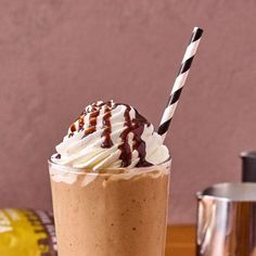 a drink with whipped cream and chocolate drizzle