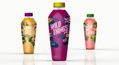 three different types of juice bottles with flowers on them and the words wild things printed on them