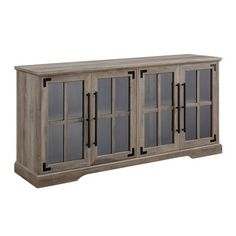 the sideboard is made from wood and has glass doors