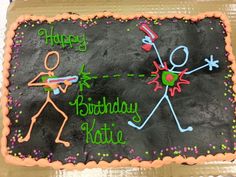 a birthday cake that is decorated with the words happy birthday krisie and two stick figures