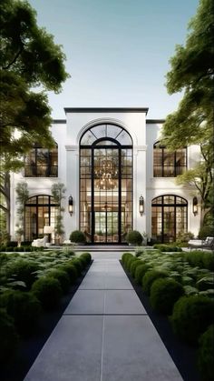 an artist's rendering of the front entrance to a large white house with lots of windows