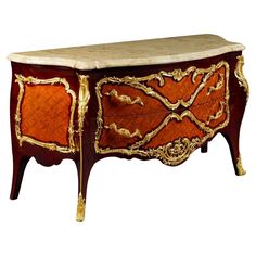 an ornately decorated chest with marble top