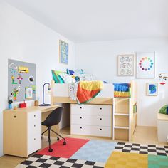 a child's bedroom with colorful rugs and furniture